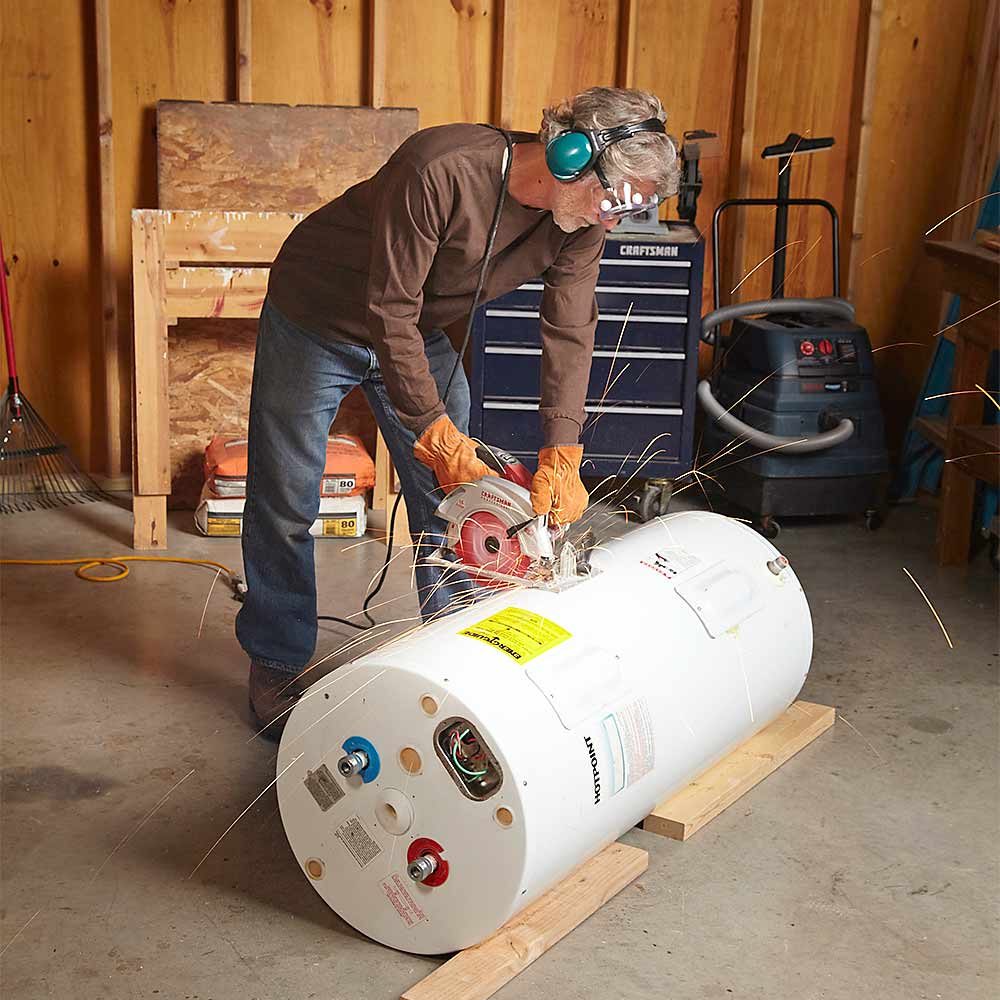 Cutting a metal water heater in half | Construction Pro Tips
