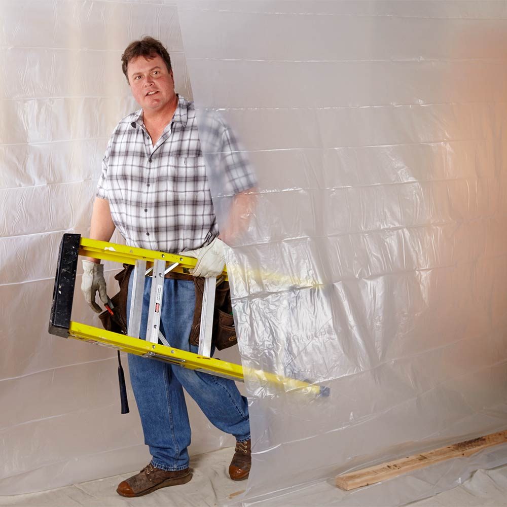 Walking through a plastic tunnel created for protection | Construction Pro Tips