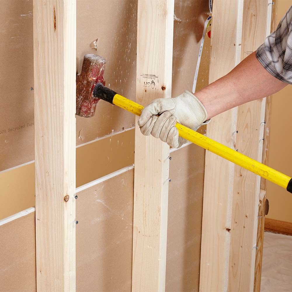 Knocking drywall out from the back side | Construction Pro Tips