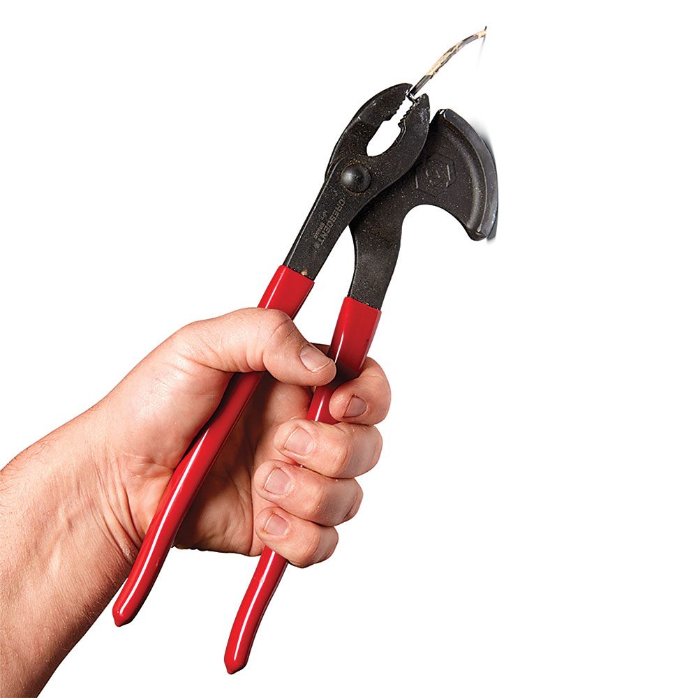 Holding nails in the teeth of a pair of pliers | Construction Pro Tips
