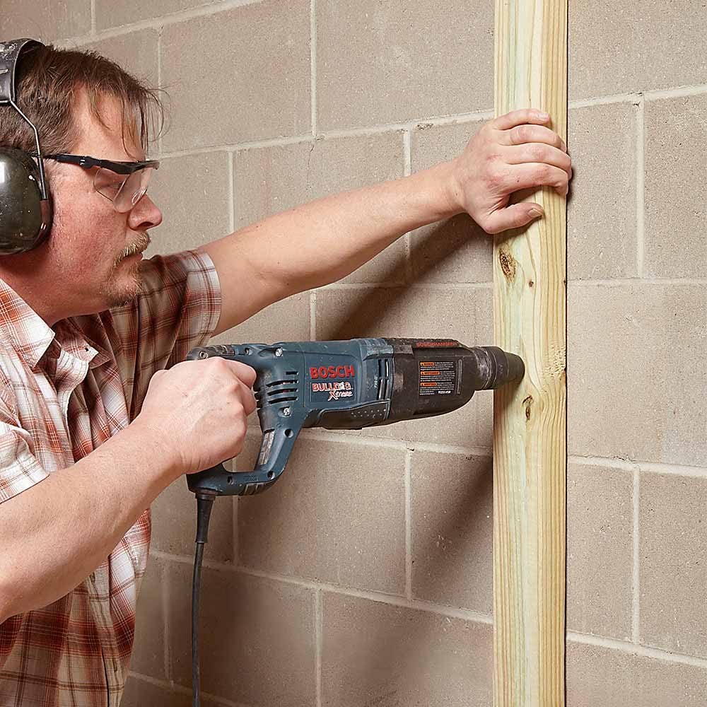 Drilling through treated wood into concrete | Construction Pro Tips