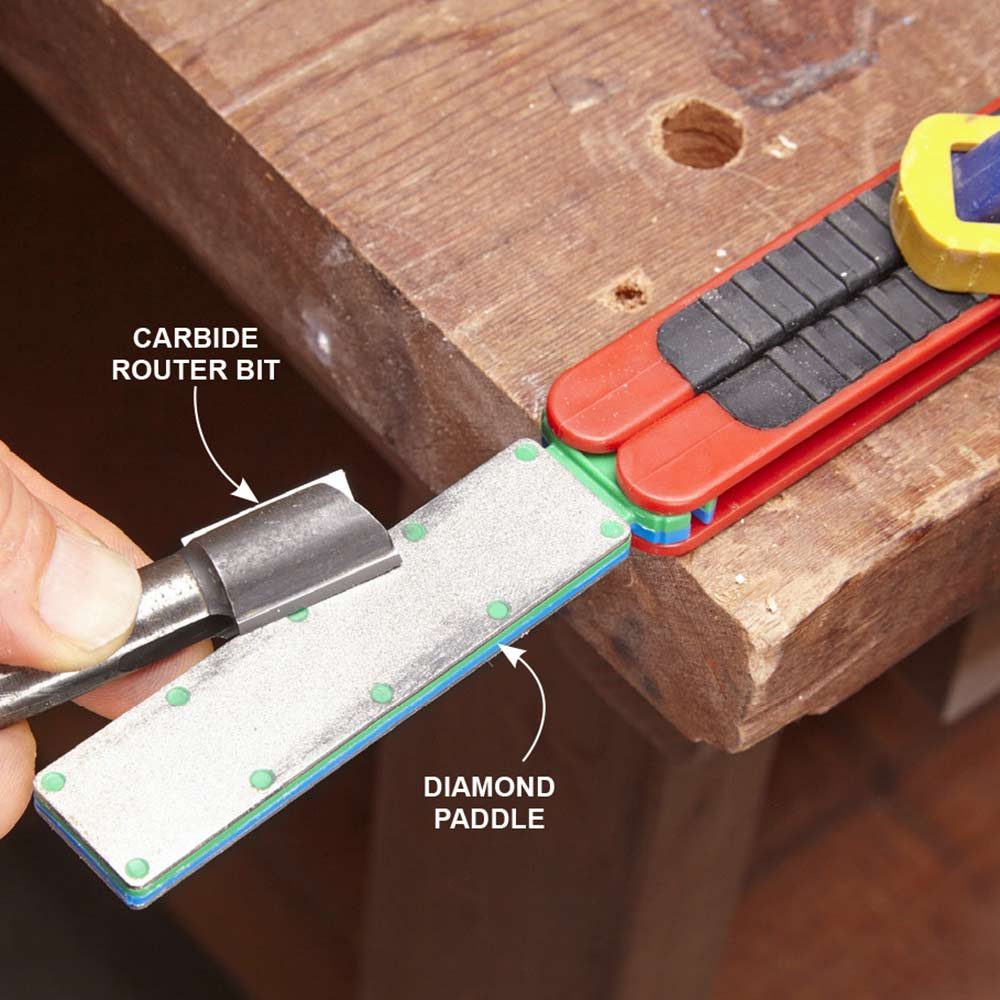 Sharpening a router bit on a diamond paddle