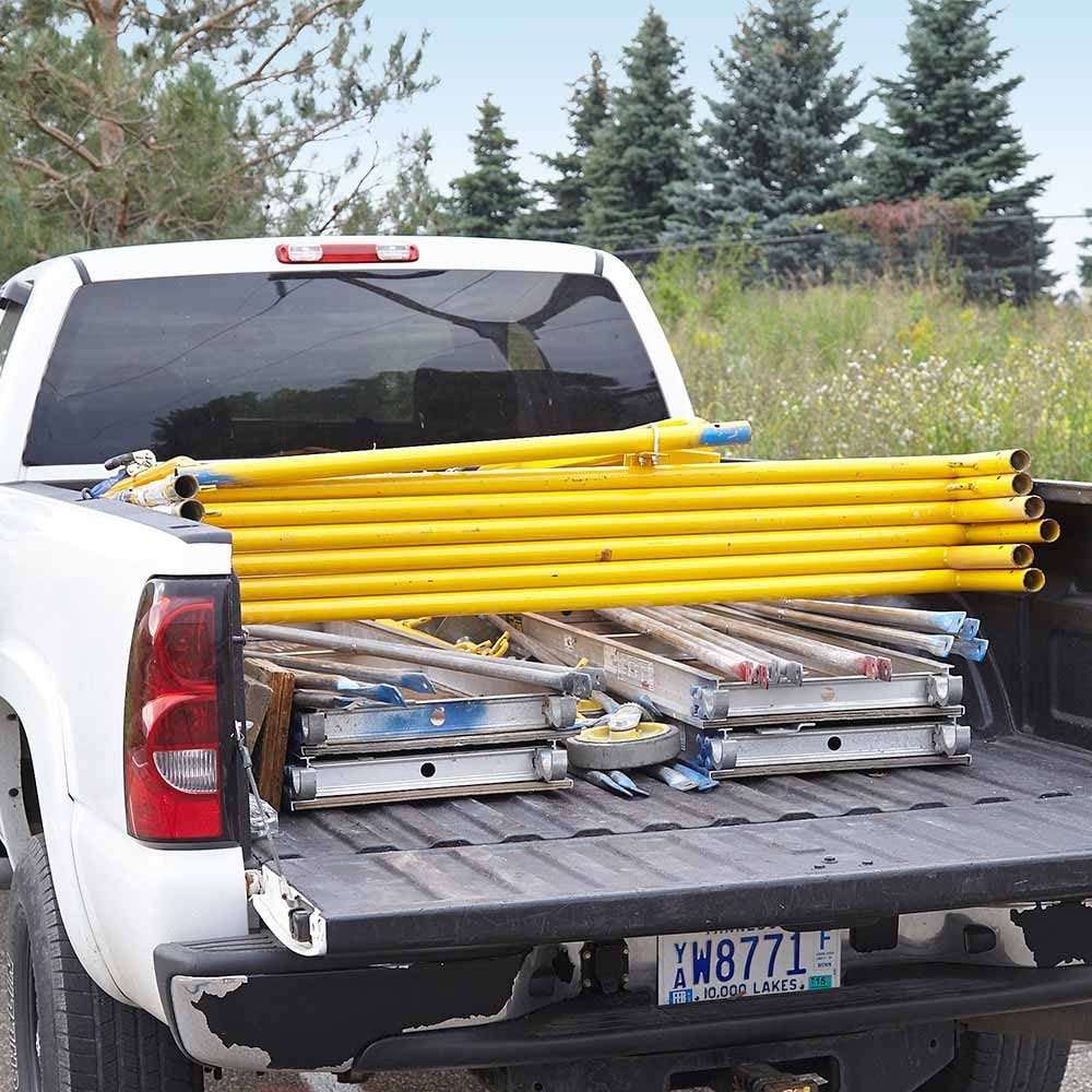 Scaffolding stacked in the bed of a truck | Construction Pro Tips