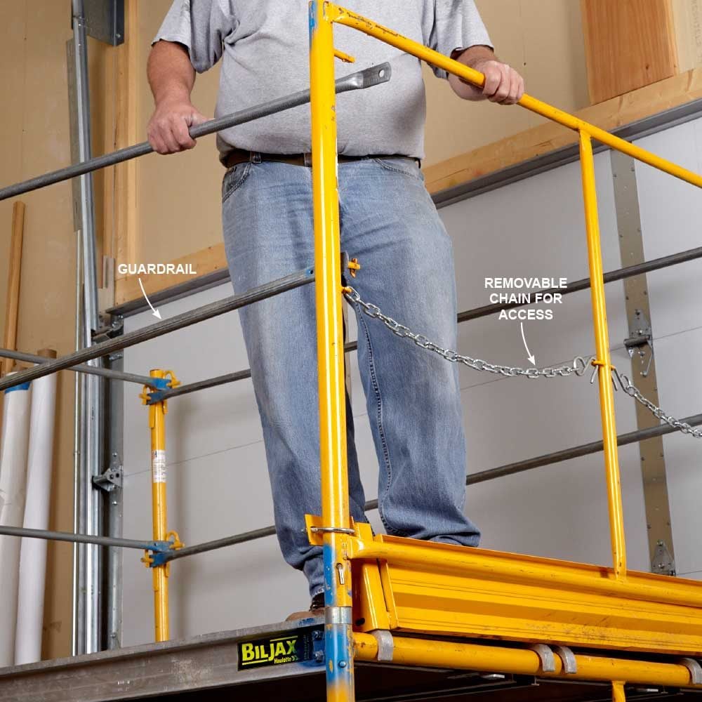 Putting a scaffold guard rail in place | Construction Pro Tips