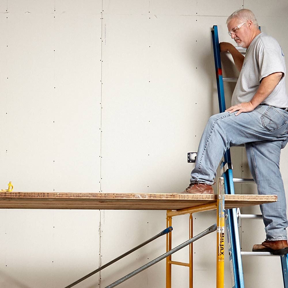 Accessing the scaffolding with a ladder on the wall | Construction Pro Tips