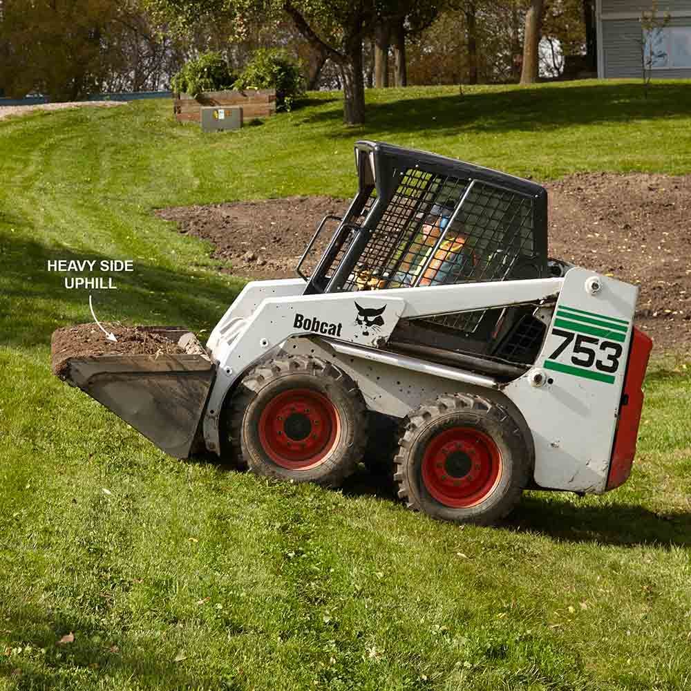 Skid steer on a hill