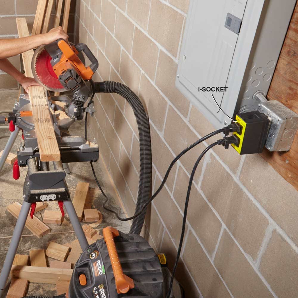 A vacuum plugged directly into a miter saw | Construction Pro Tips