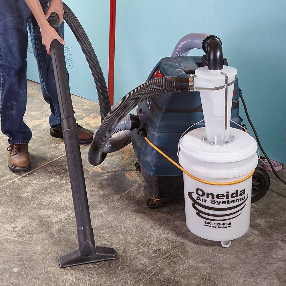 An air and debris filtration system hooked up to a vacuum cleaner | Construction Pro Tips