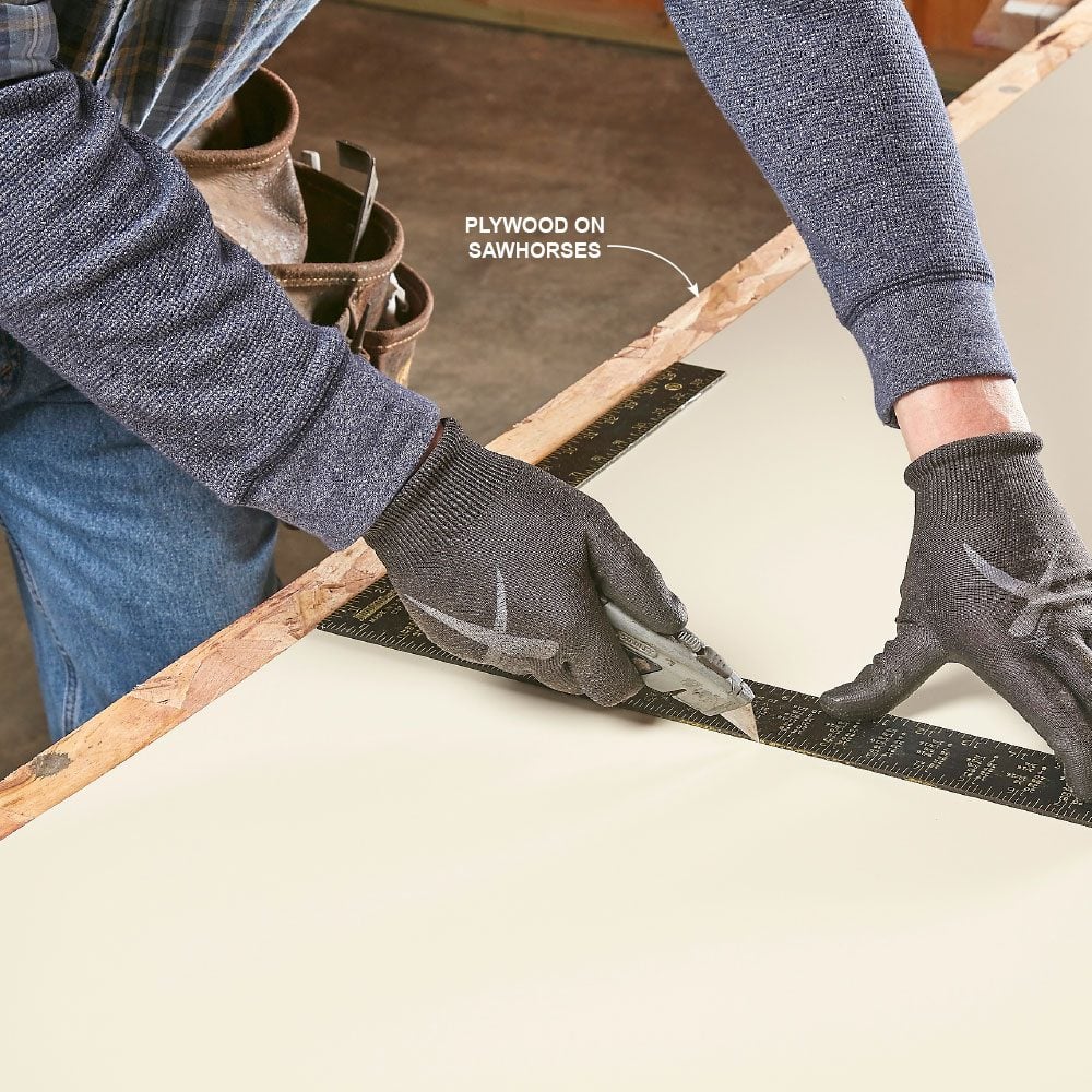 Scoring metal with a utility knife and a framing square | Construction Pro Tips