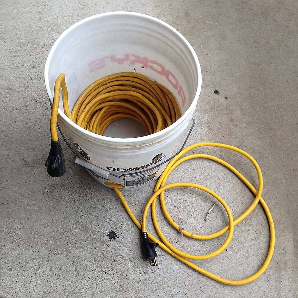 Extension cord built into a bucket | Construction Pro Tips