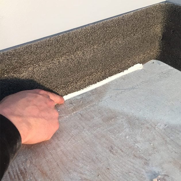Caulk the sill sealer at the floor line along the walls | Construction Pro Tips