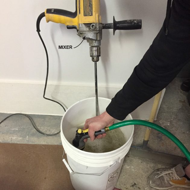 Filling the mixer bucket with a hose | Construction Pro Tips