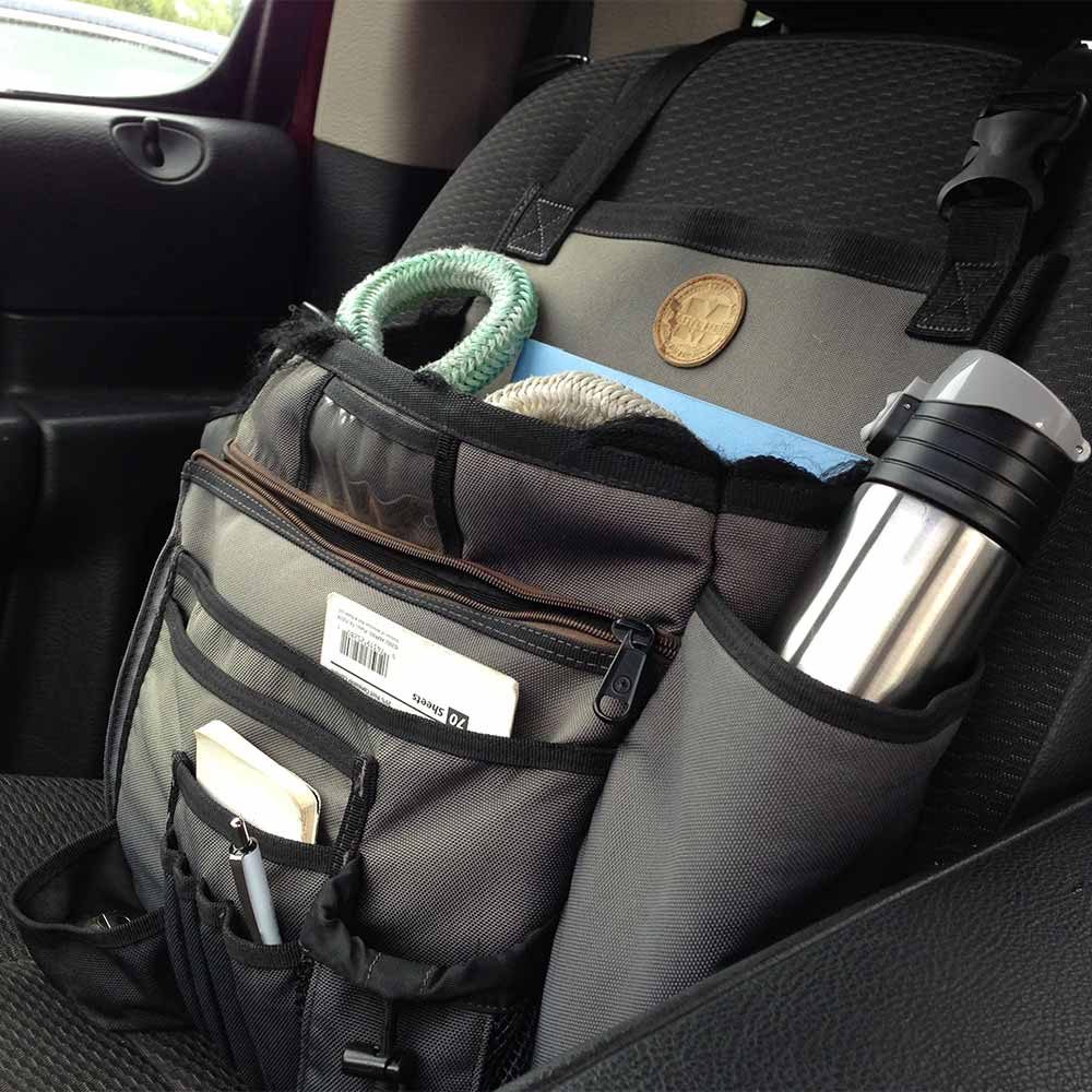 A 'Cab Commander' bag strapped to the passenger seat of a truck | Construction Pro TIps