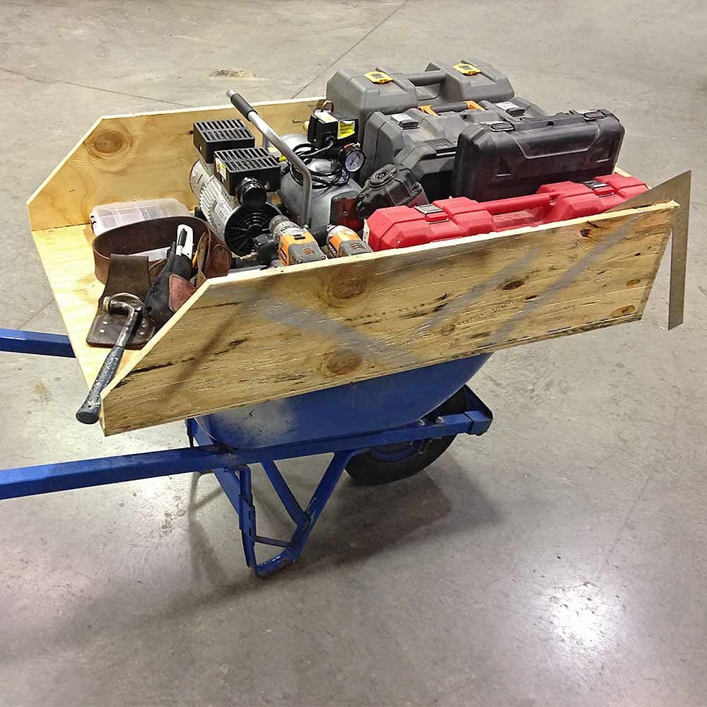 A homemade carrier for supplies built for a wheelbarrow | Construction Pro Tips
