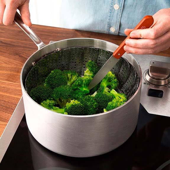 Steamed broccoli is done when you can easily pierce the thickest part with a knife.